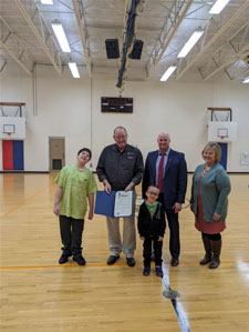 picture of students with adults in the gym