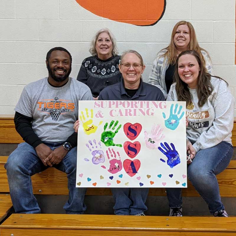 group-holding-support-sign